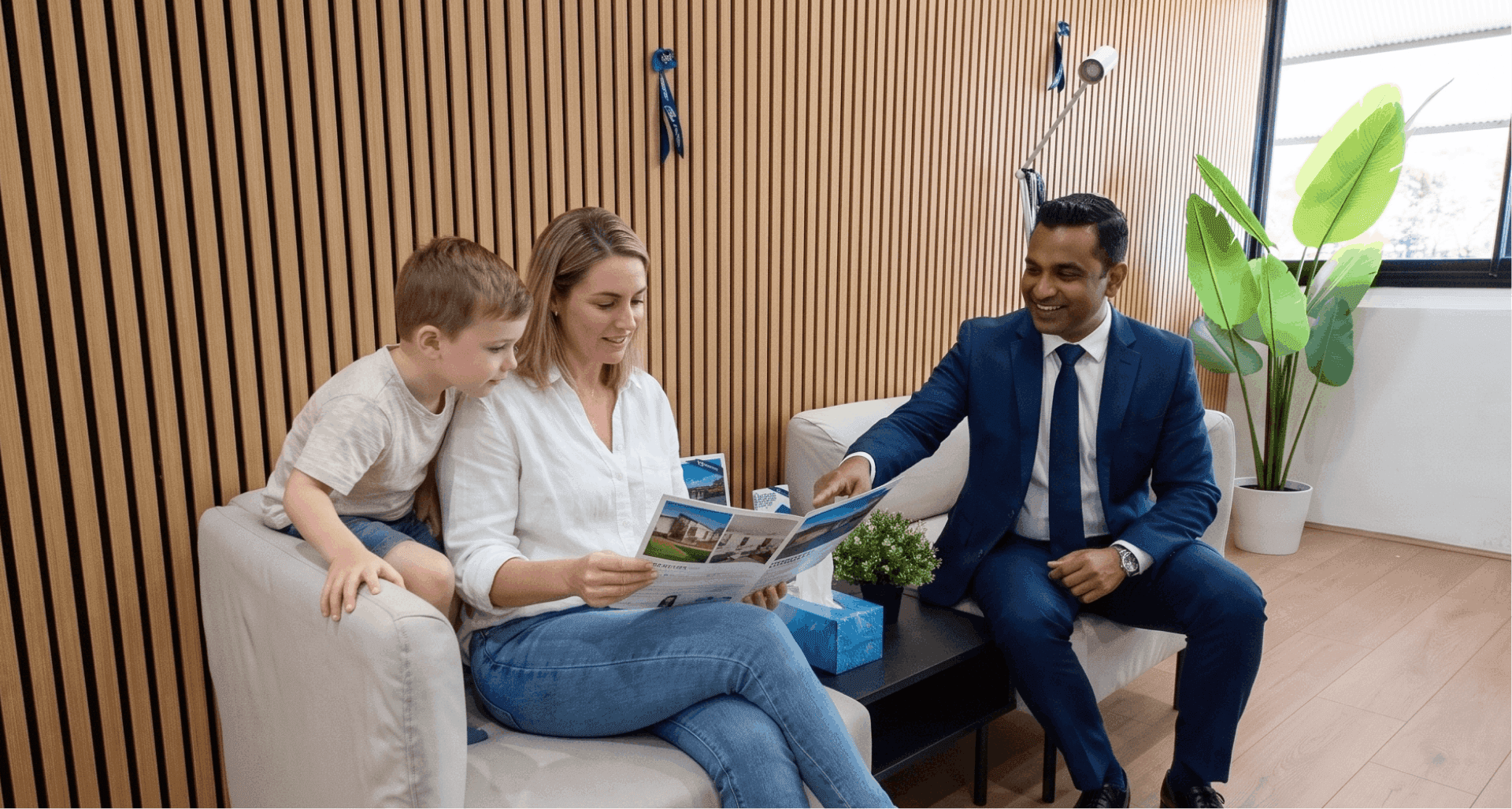 A BlueRibbon agent going through property listings with a family